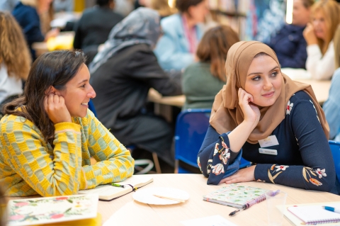 Two teachers at a table