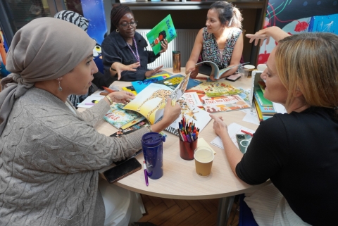 Teachers discussing books in CLPE's Literacy Library